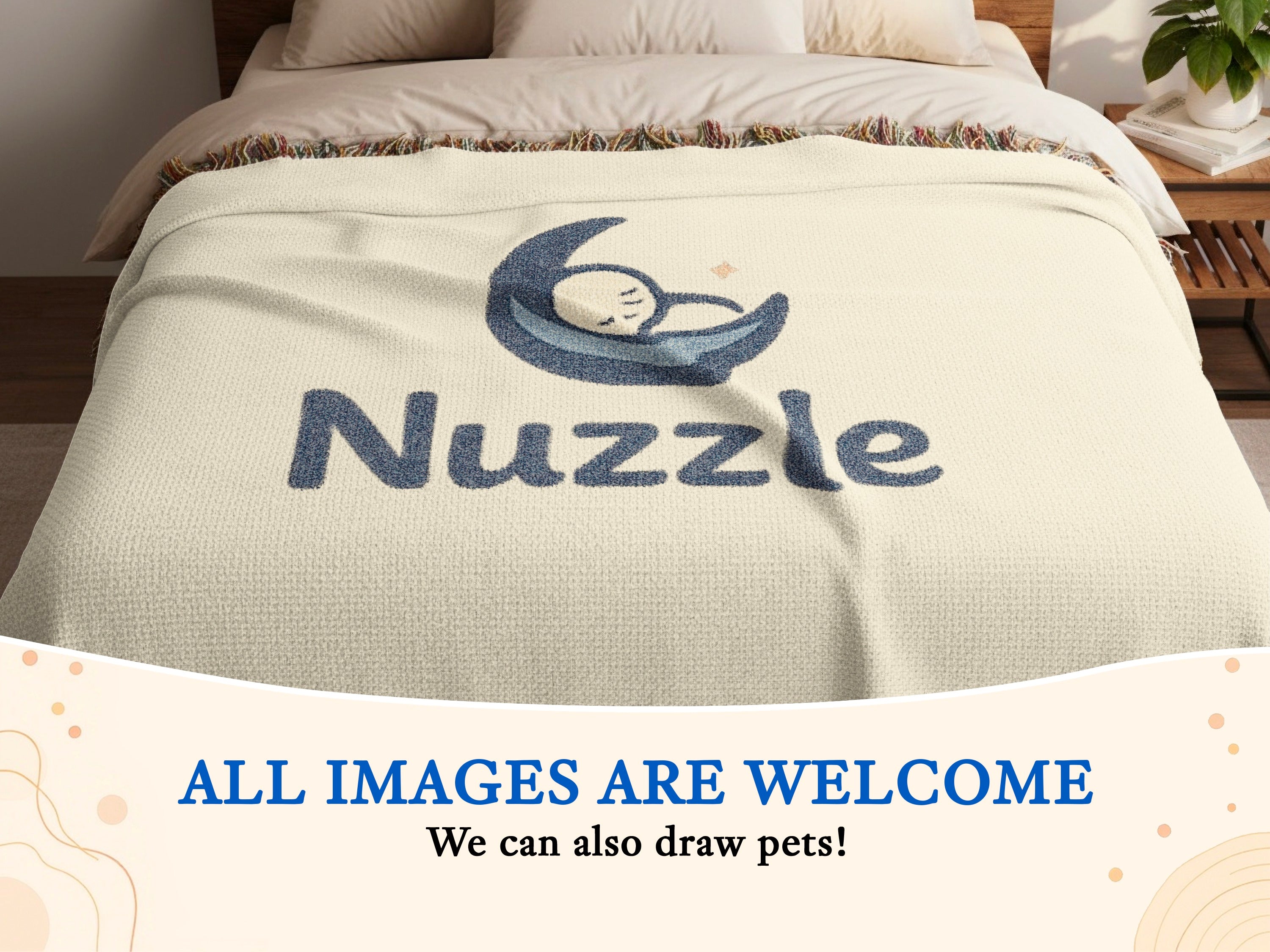 Cream blanket on a bed with "Nuzzle" text and a sleeping baby graphic.
