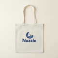 White canvas tote bag with Nuzzle moon logo on front